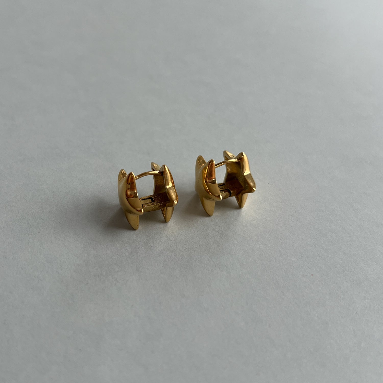 Gold colour star earrings