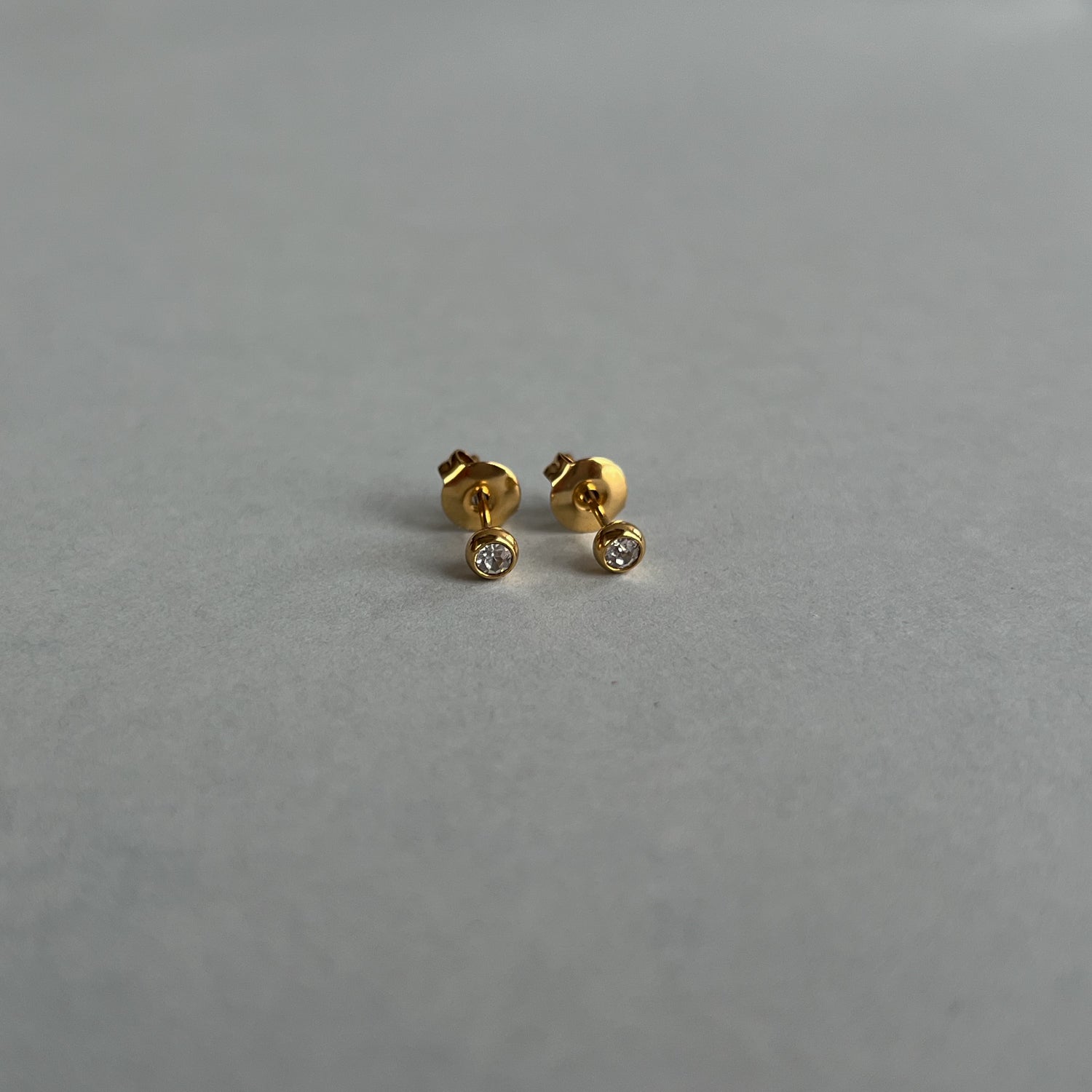 Gold colour small studs with zircons