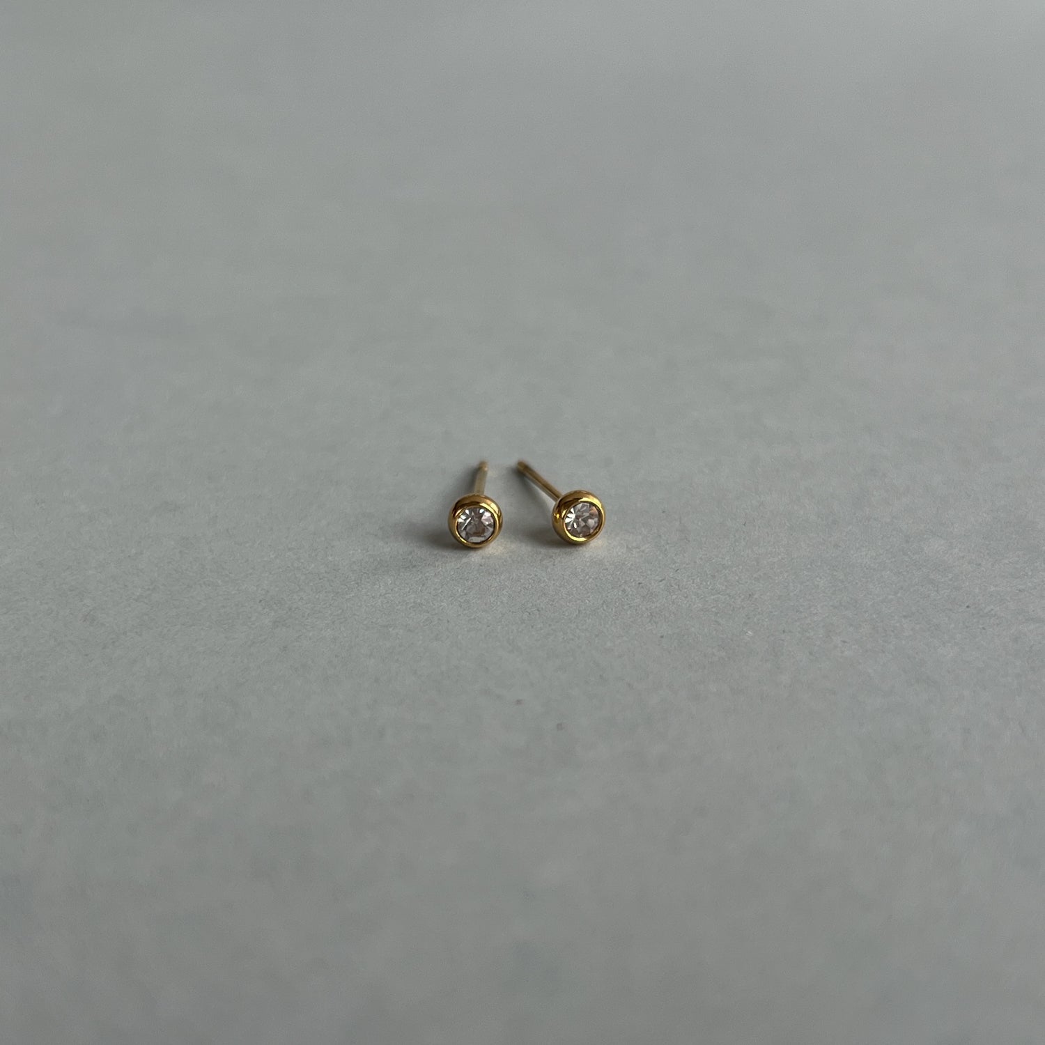 Gold colour small studs with zircons