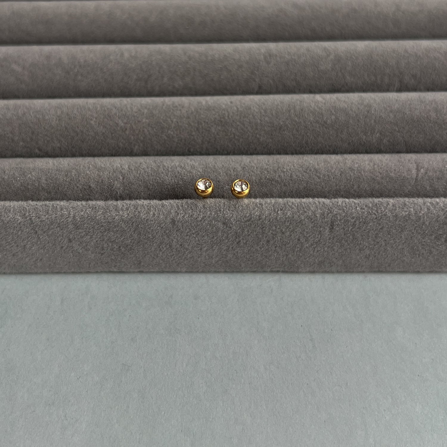 Gold colour small studs with zircons