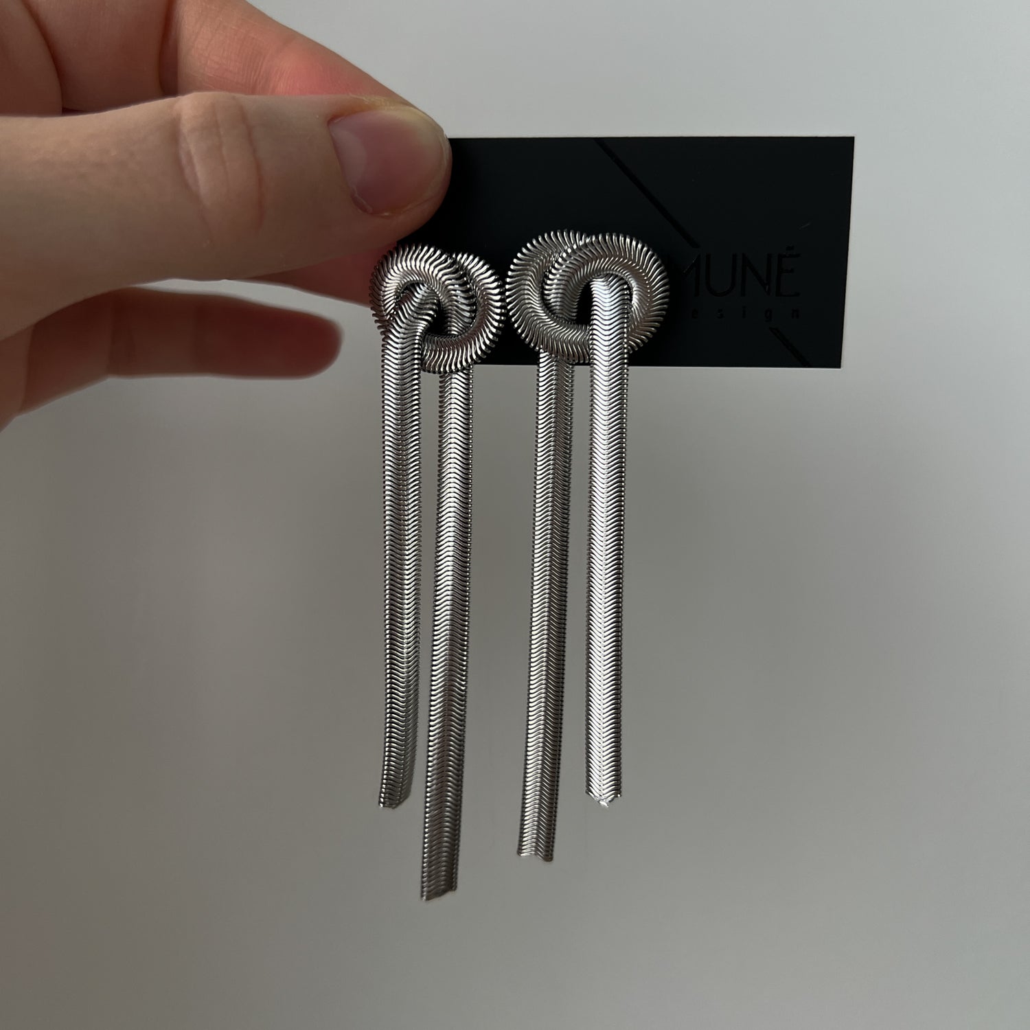 Silver colour dangle earrings