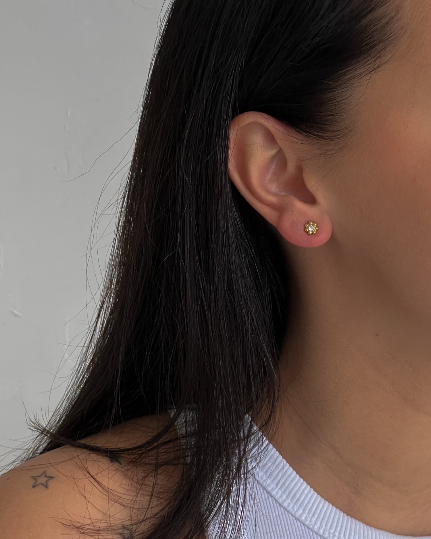 Gold colour small flower studs with zircons