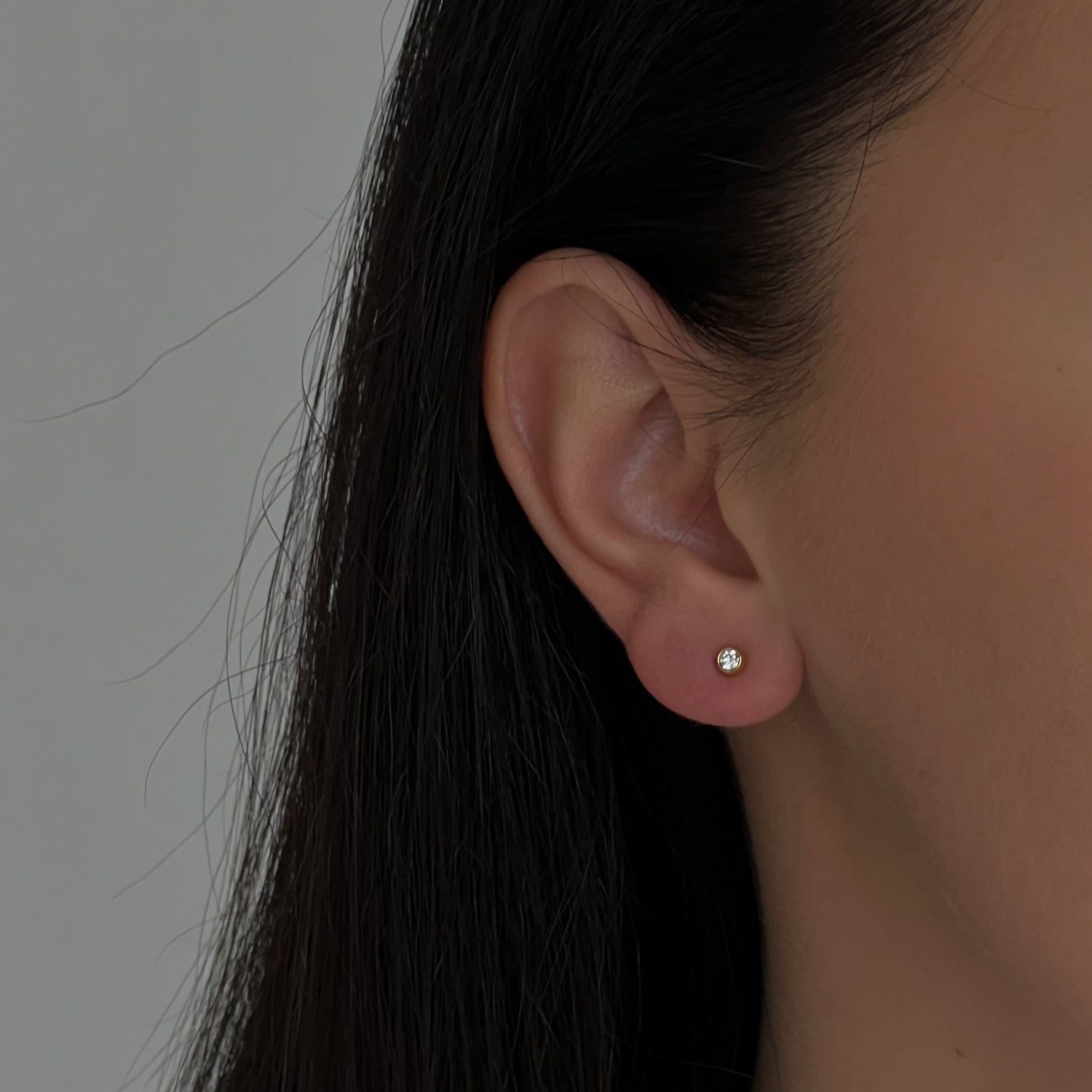 Gold colour small studs with zircons