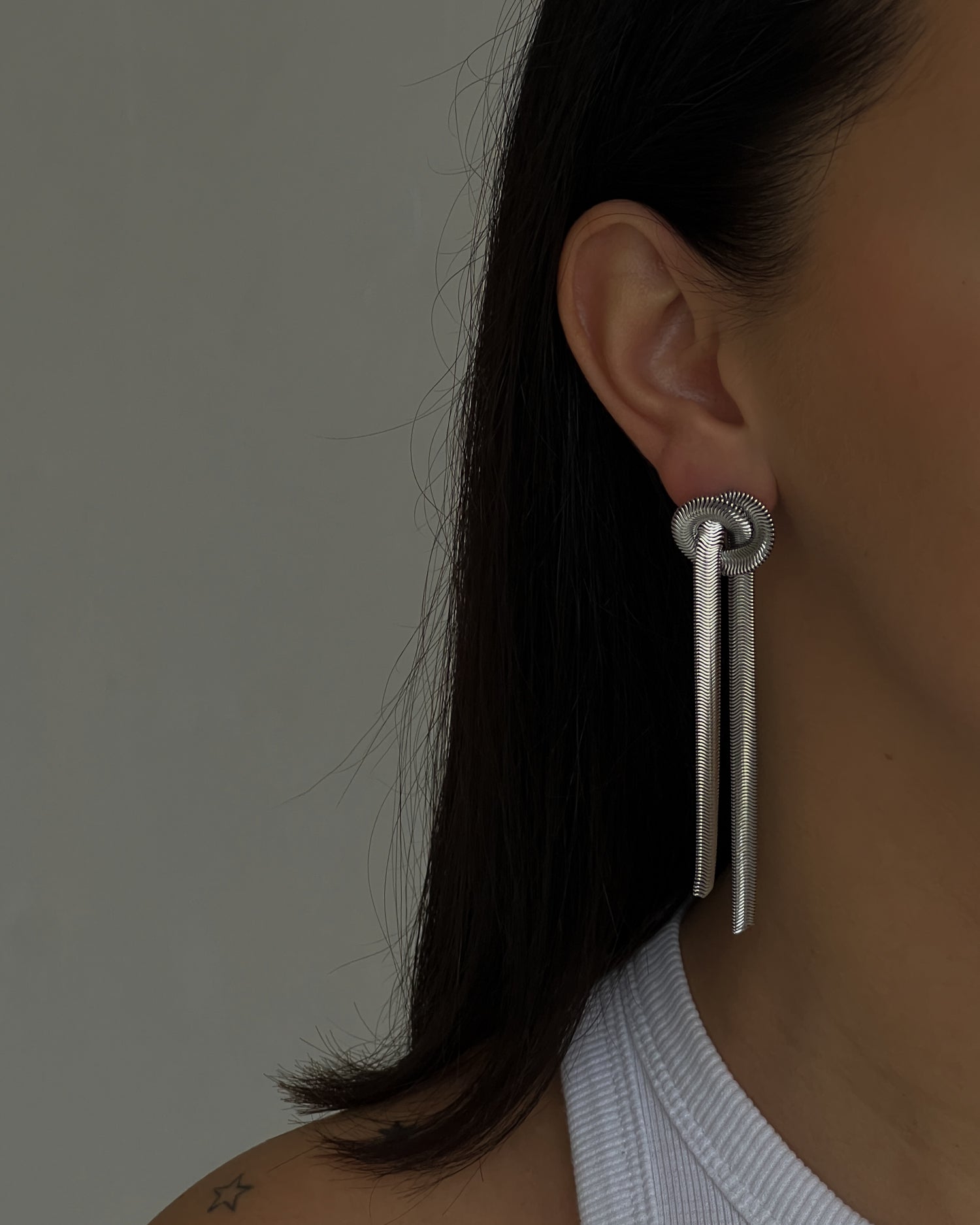 Silver colour dangle earrings