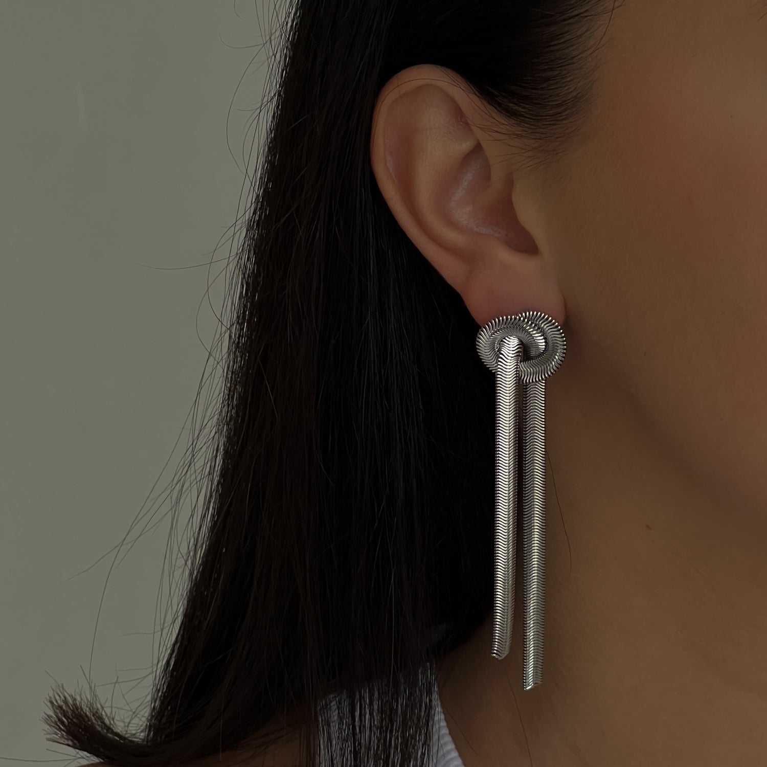 Silver colour dangle earrings