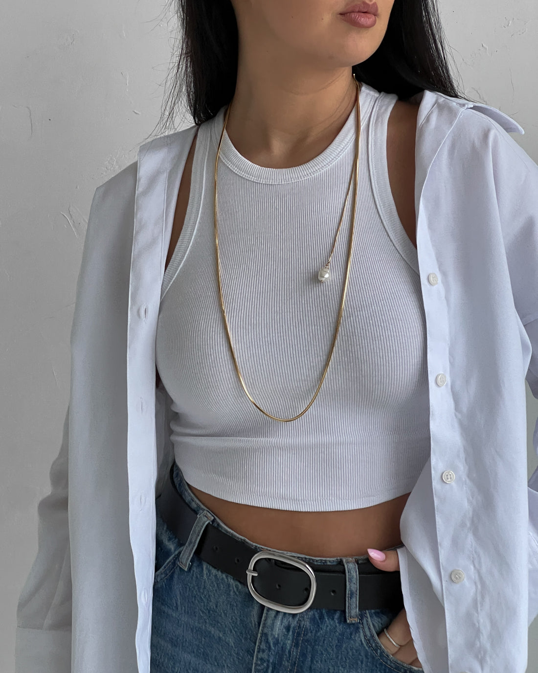 Modern gold necklace with a pearl