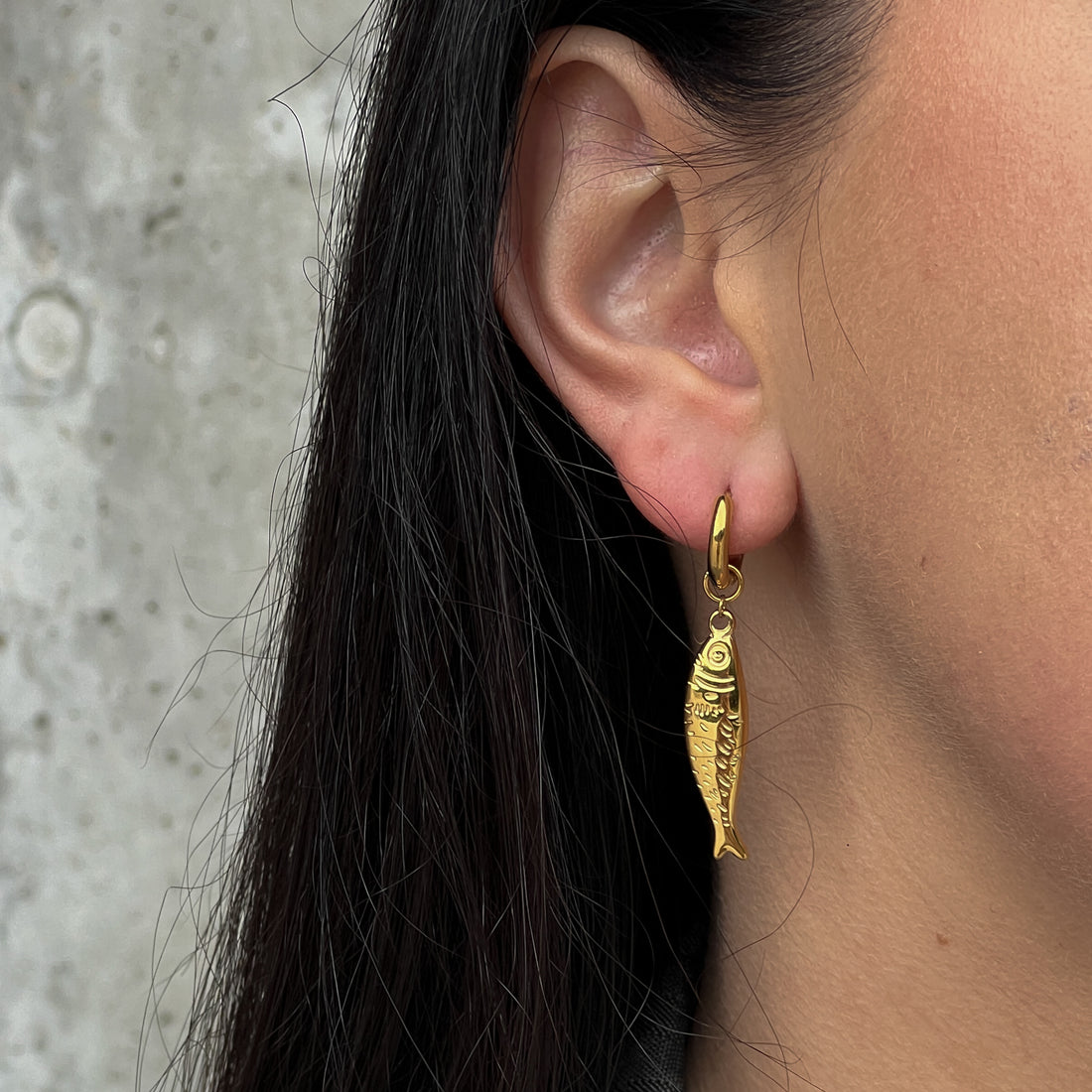 Gold colour hoops with fish pendants