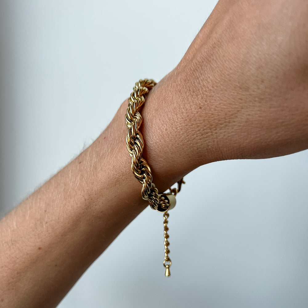 Twisted gold colour bracelet