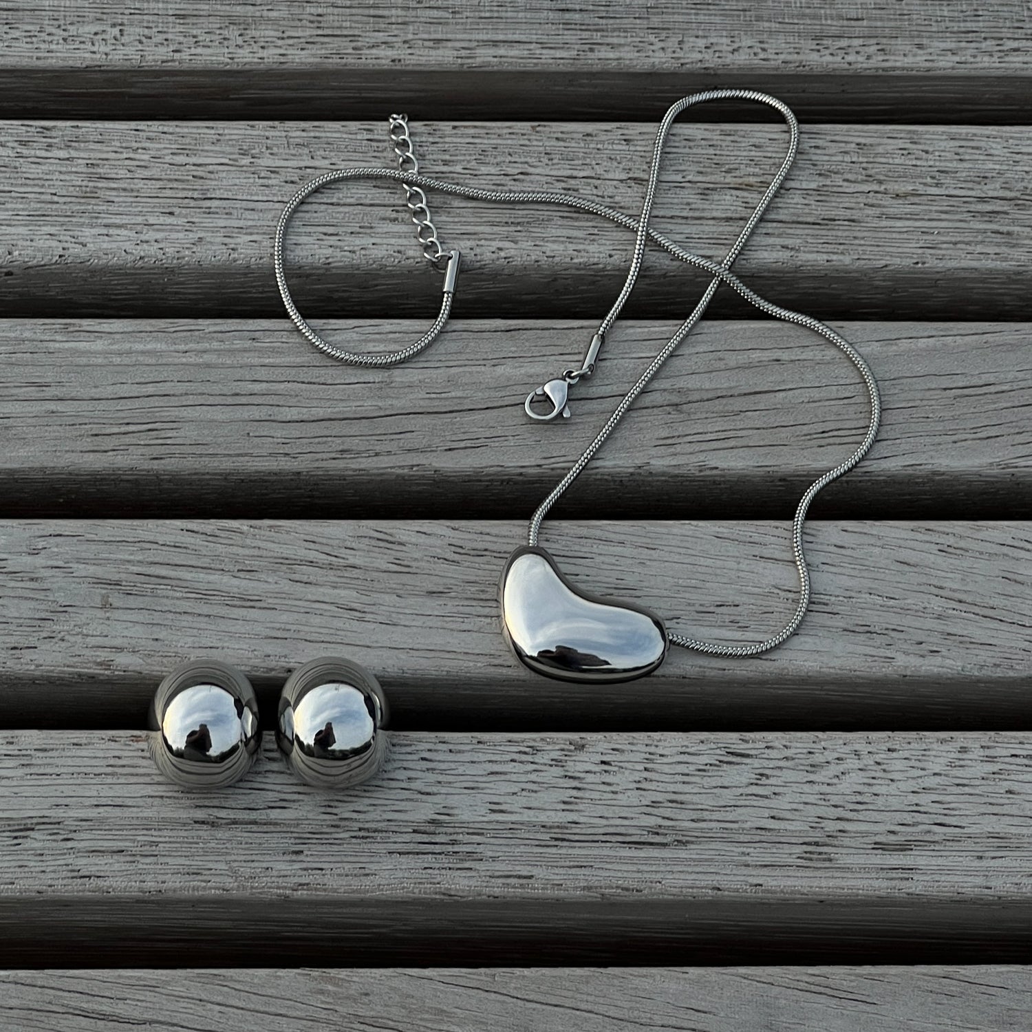 Two sizes silver colour drop shape stud earrings