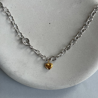 Silver colour choker necklace with gold heart