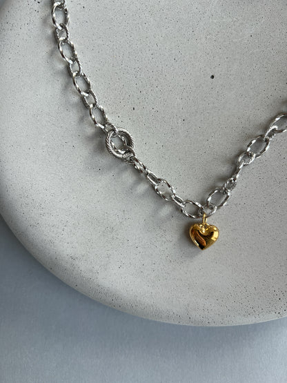 Silver colour choker necklace with gold heart