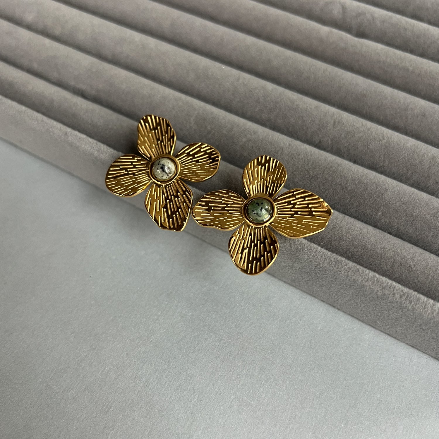 Big flower gold colour stud earrings