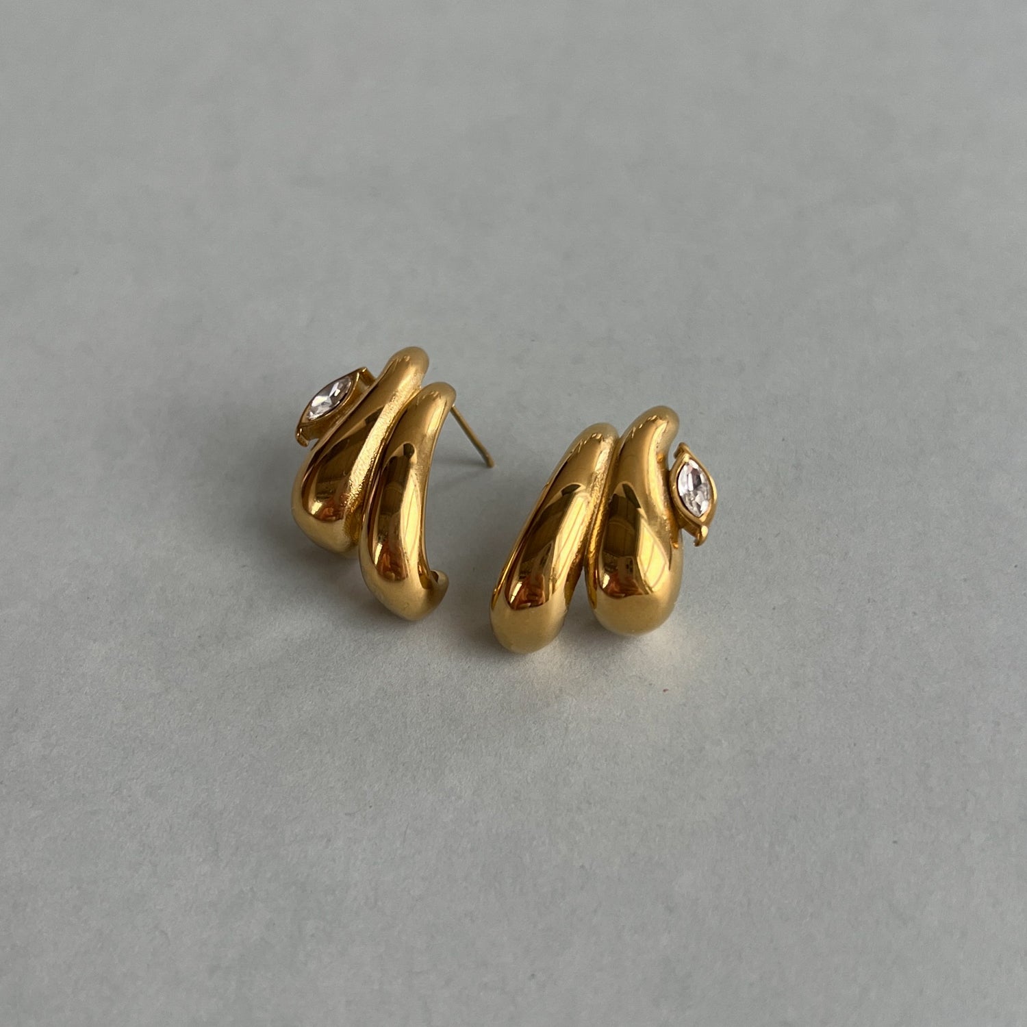 Gold colour studs with zircon