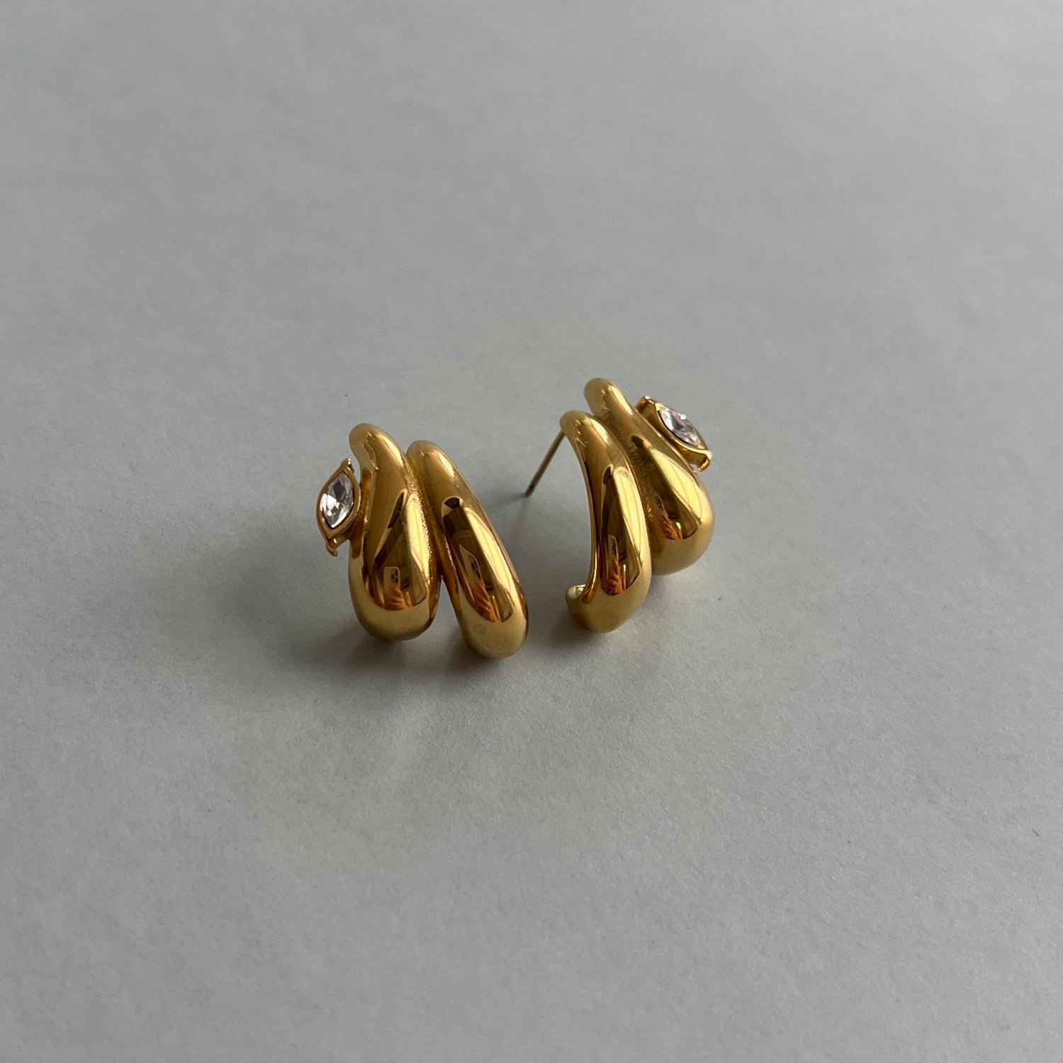 Gold colour studs with zircon