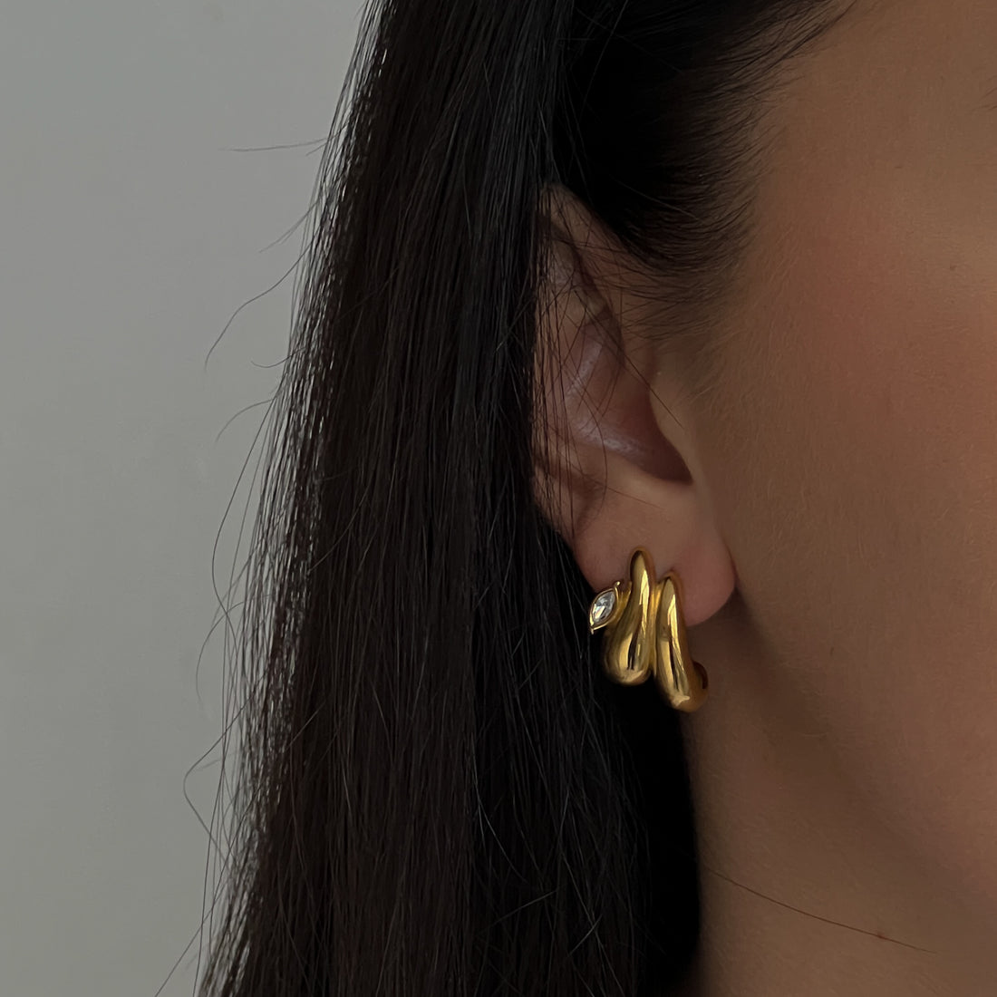 Gold colour studs with zircon