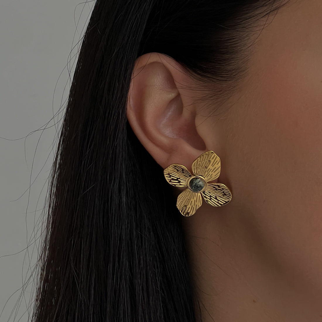 Big flower gold colour stud earrings