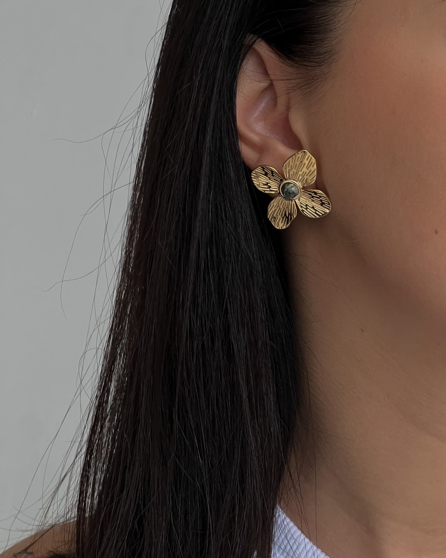 Big flower gold colour stud earrings