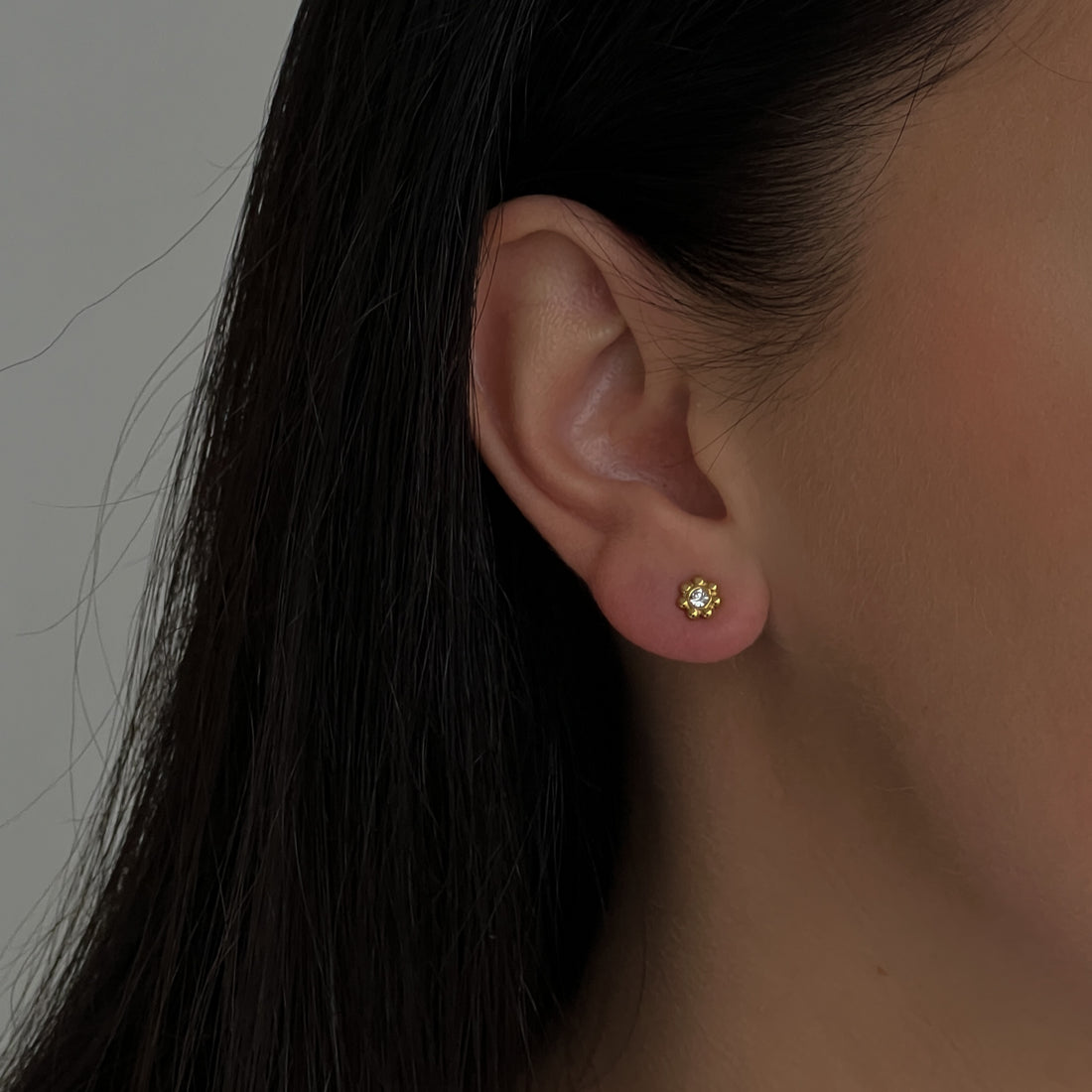 Gold colour small flower studs with zircons