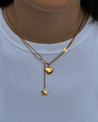 Necklace with a heart and star pendants